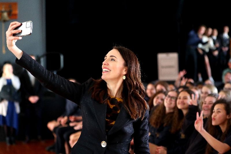 New Zealand Prime Minister Jacinda Ardern takes a selfie with students at Northcote College on July 03, 2020 in Auckland, New Zealand.  (Photo by Hannah Peters/Getty Images)